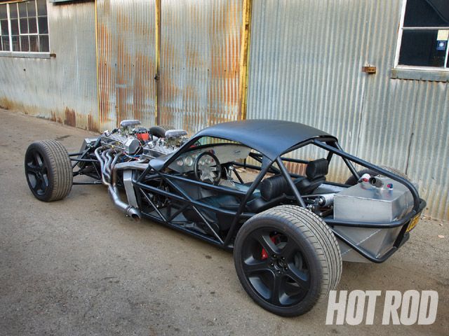 This rat rod has offroad truck steering wheel Auto Meter gauges in the